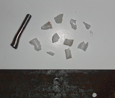 projectile core and what fragments of sabot and fins I was able to recover, along with the impact mark on the plate
