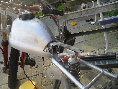 Seat bracket.<br />It swings on the custom hinge welded to the frame and is supported by the re-assigned mono shock.