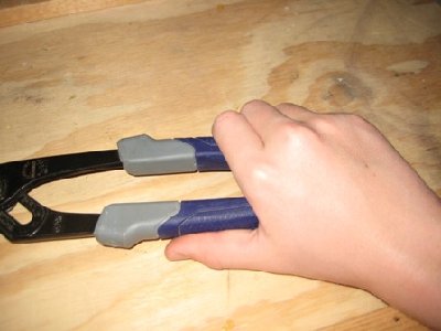 Make sure to hold the channel locks at the end of the handle for maximum leverage.