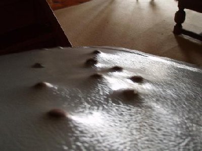 This is a side view f the metal sheet i shoot at and the dents from the marbles.