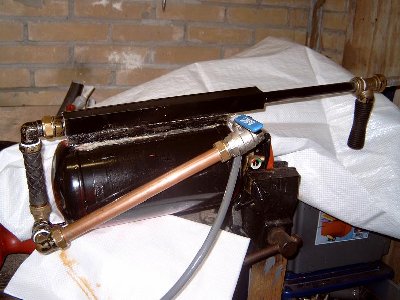 Overall peek of the entire gun.Note the front &amp;quot;tommy-gun&amp;quot;style handle.<br />This marble MG is meant to be fired from the hip.( See how messy my workshop is?)<br /><br />I just sprayed it with some black paint, cause I HATE red!!