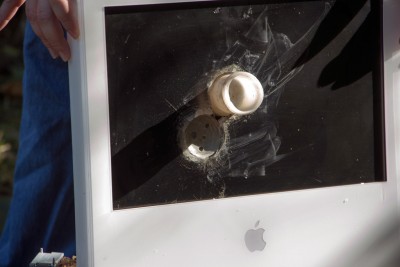 iMac, right after the second compound round shot.  The first shot didn't leave a piece of the round in the screen.  That is actually just the outline of the round embedded in the LCD material.  Wifi card that came out in the extreme lower bottom.