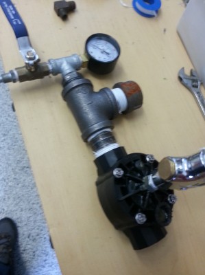 Filling station with sprinkler valve and trigger. Cap on where the piston housing normally is.