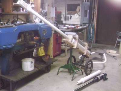 Here's the whole dang thing compared to a regular potato gun, with a shell next to it.