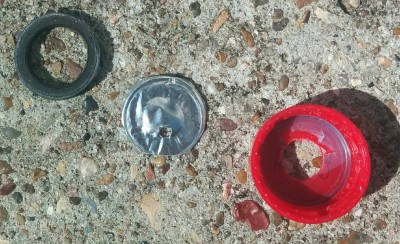 My makeshift gasket/O-ring, a burst disk, and the cap. You can see how the burst disk didn't actually rupture but was just punctured.