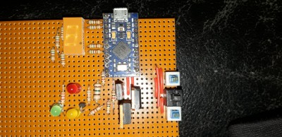 The circuit on veroboard. I haven't decided what the small buttons will do, but the big one is for injection. Maybe the small ones wil select different functions for the big one.