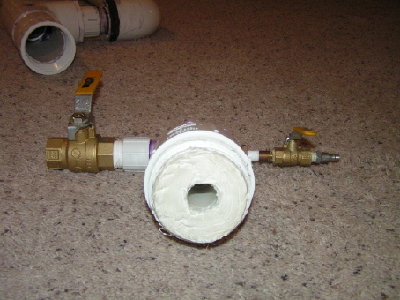 Picture of the fill/exhause/bumper.  The fill is a 1/4&amp;quot; ball valve and quick connect, the exhaust is a 1&amp;quot; ball valve, and the bumper is a thick layer of caulk.