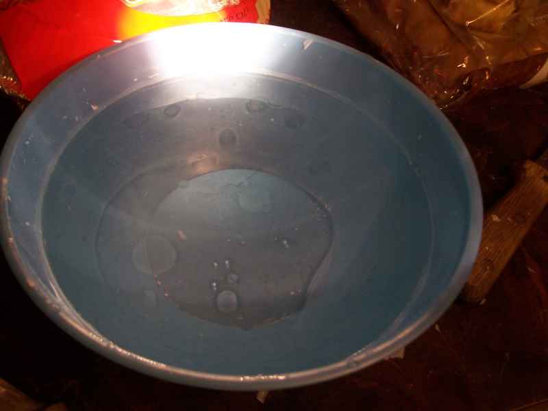 step 9-C<br />When a good layer of wax has formed on the surface, you can see globules in the bowl by shining a flashlight in.