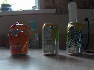 About the only thing I had to shoot at were popcans.  I want some steel soup cans to shoot at.  Looks like it's soup for lunch!  The one on the far right was full of water when I shot it.