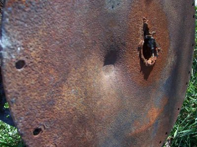 I had part of an old satalite dish which looked like a prime target.<br />This thing probably weighs 20-30 pounds, and was thrown back about 5 feet from impact.<br />This picture gives a better look of the depth of the dent than the second.