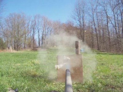 freezeframe of some 3/4 inch plywood getting a hole put in it.  The projectile was a 4&amp;quot;x .5&amp;quot; aluminum slug, and was no where to be found.