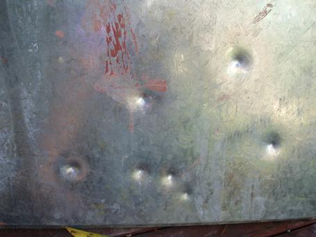 Some sheet metal with marbles.