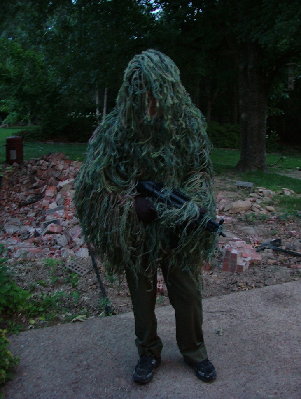 Me wearing my uber cool looking Ghillie suit and holding my ICS MP5 A4 with a rifle rag wrapped around it