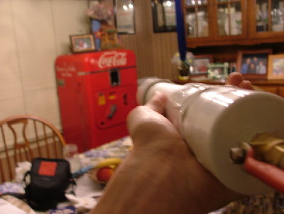 me holding the launcher in the firing position