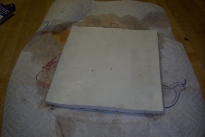 flattened on the counter with a skillet