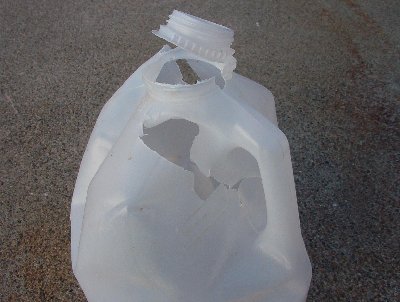 Water-filled milk jug shot with 1&amp;quot;X.5' metal pipe. The first shot was too high and skimmed the top, just breaking the lid. The second shot went through both sides and went about 60-70 meters.