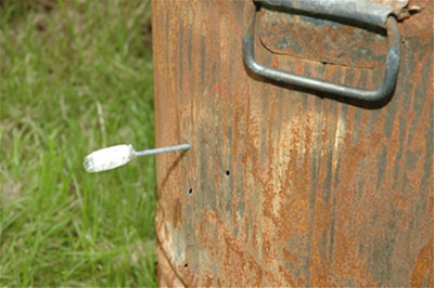 Nail dart through metal bin