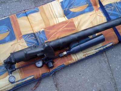 At an angle.You can see, while holding the gun, I can look down and check the gauges.One to indicate bottle pressure( 800+ psi) and the other to show the canon's pressure