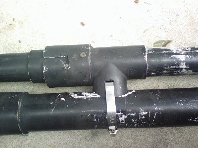This system allows the barrel to slide forward to open the breech.  The larger coupling (2&amp;quot;) was screwed to the 1.5&amp;quot; tee because it was slightly too big to use glue.  The coupling was then gapped out, as shown, to allow for a locking mechanism.  The tee was slit and secured to the chamber with a clamp.