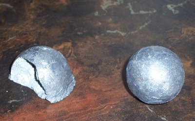 Before and after. I have the missing chunk laying around somewhere, but I can't find it right now.<br /><br />The edge on the bottom where the chunk broke off conforms perfectly to a small crack that was already in the brick. Apparently metal acts very differently at high speeds.