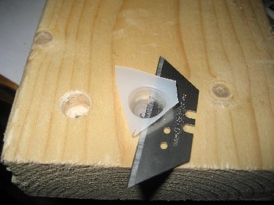 I use a wooden block with two holes in it to cut the cones consistently, one hole that fits the diameter of the nail that goes  all the way through, and a whole with the ID of the barrel +1mm to make a tight fit. note that the last hole only goes as deep as the cone has to go before it rests on the edge. (if you dont understand what the h im talking about, please tell me. im not very good at the english explanation ;))