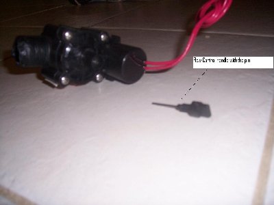 The valve with the flow control handle unscrewed and removed