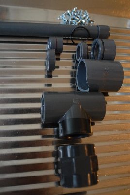 The complete parts line-up, before assembly. The thing above the tee is a 40mm bushing that fits over one branch of the tee (with a little heating).