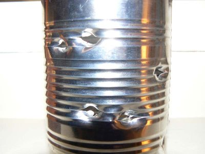 Damage to a tin soup can with 6mm airsoft BBs at 200psi. BBs went through both sides.