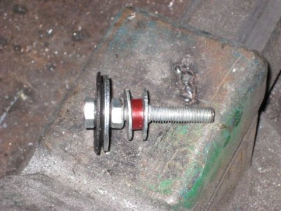 piston from side the red thing is a piece of rubber hose and is a bumper.