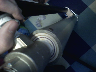 The home made bushing (yes, there is a dirty sock in the picture)