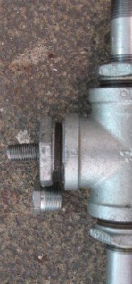 Here is a closeup of the tee, I guess I will have to either cut the barrel or try and pull that epoxied nipple off.